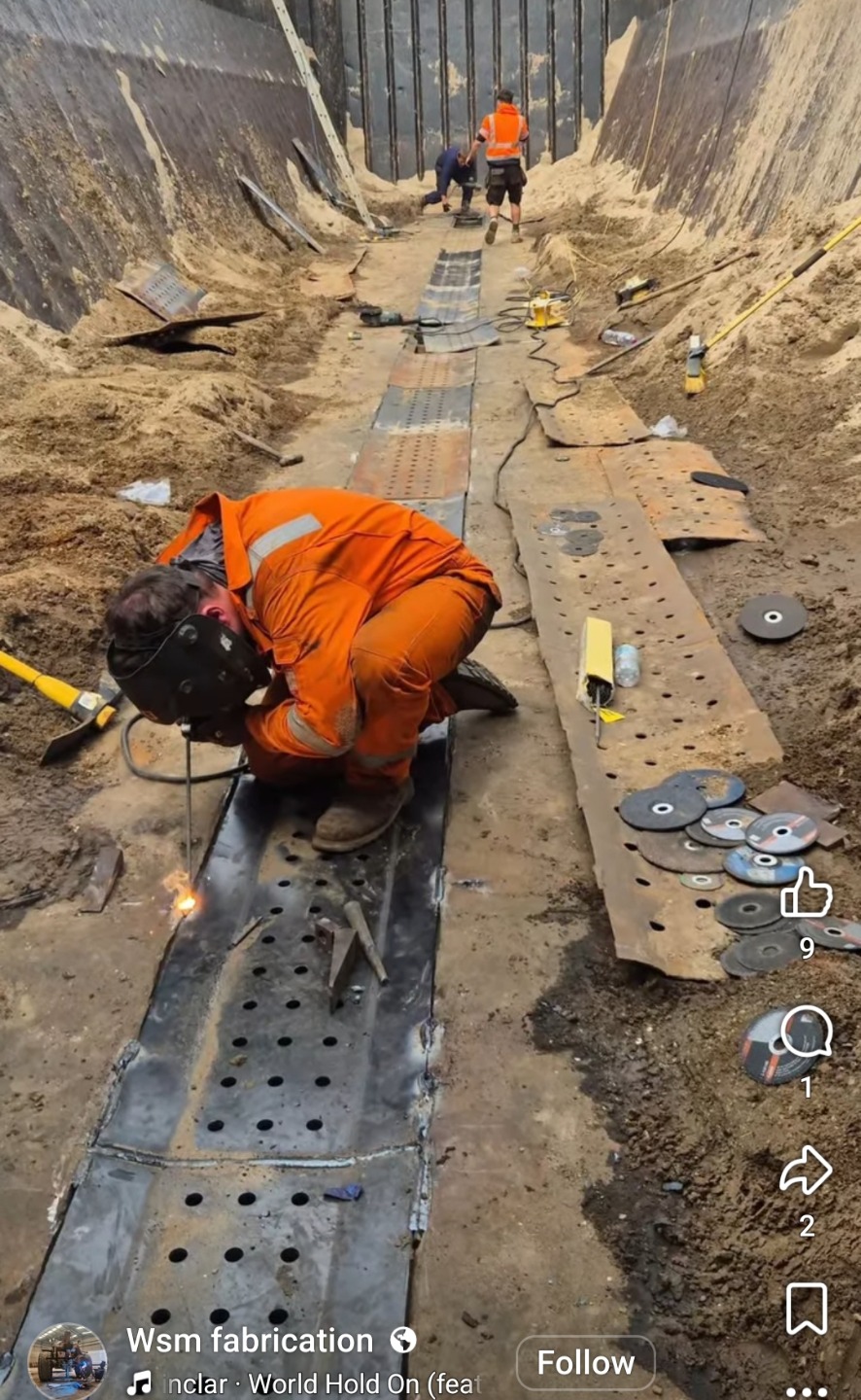 Welding steel plate in an excavated pit on site